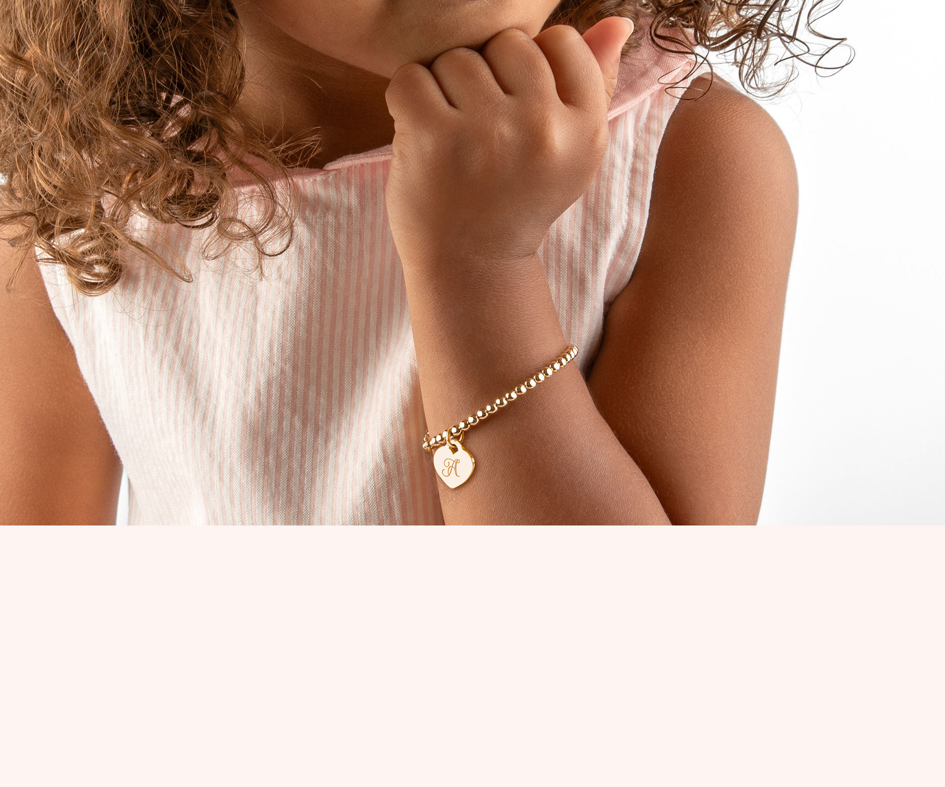 Return to Tiffany™ mini heart tag on a bead bracelet in 18k gold, medium. |  Tiffany & Co.