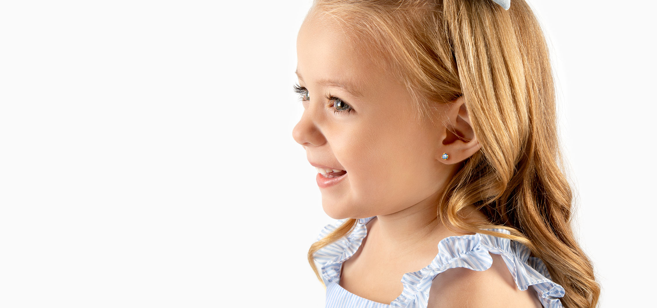 Smiling Child With Earrings